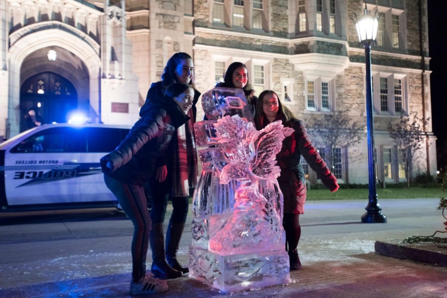 Students with an ice sculpture