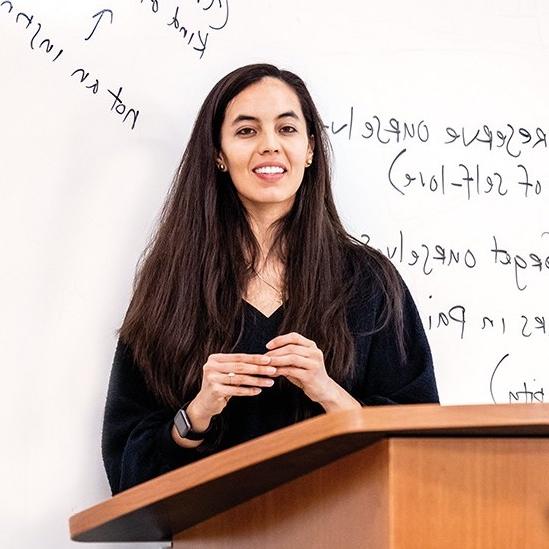 person in front of a whiteboard