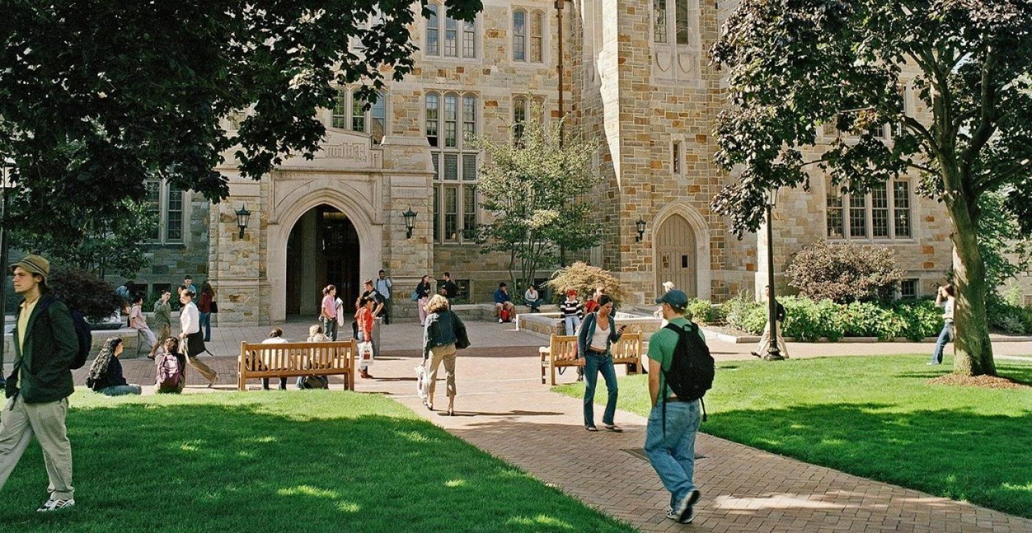 students walking in front of Fulton Hall