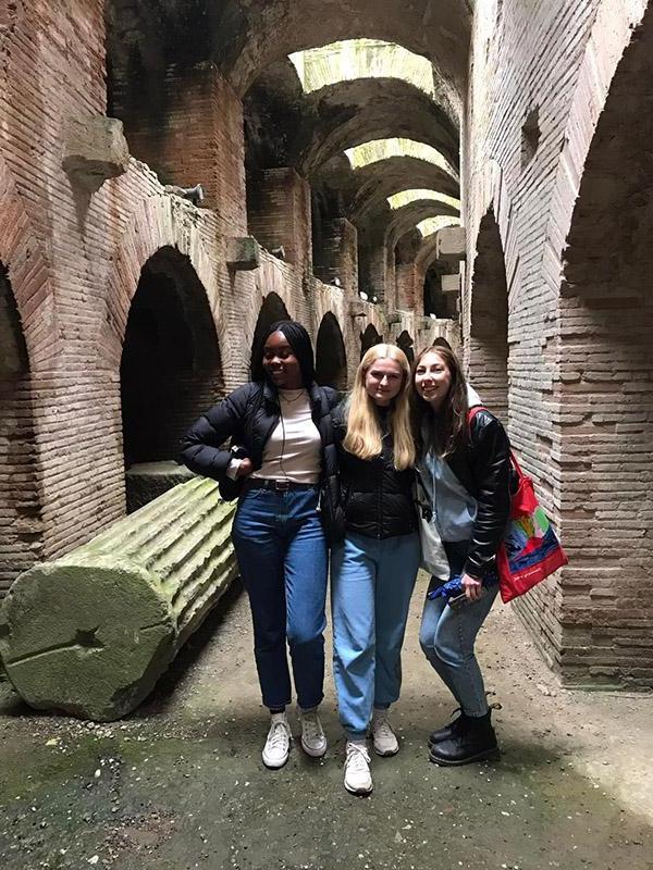 Three students in an ancient site