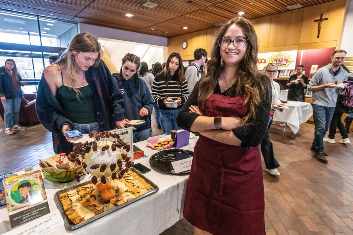 Ashlyn Stewart and her winning entry "Around the World in Seventy-Two Dates" featuring a globe-shaped cake covered with dates on toothpicks