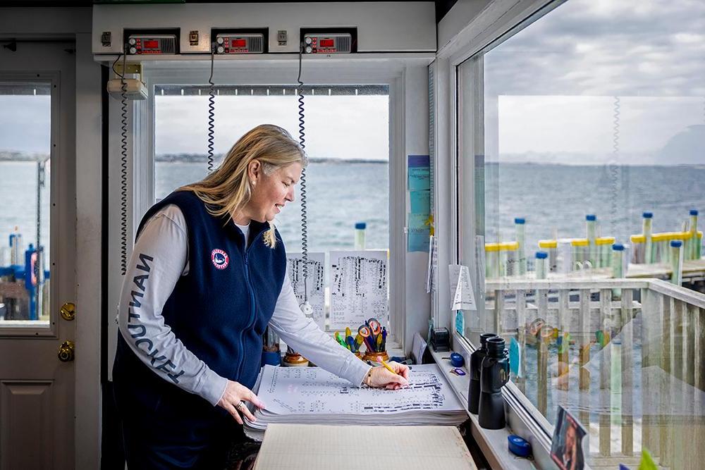 Christina Martin writing on a chart in her office