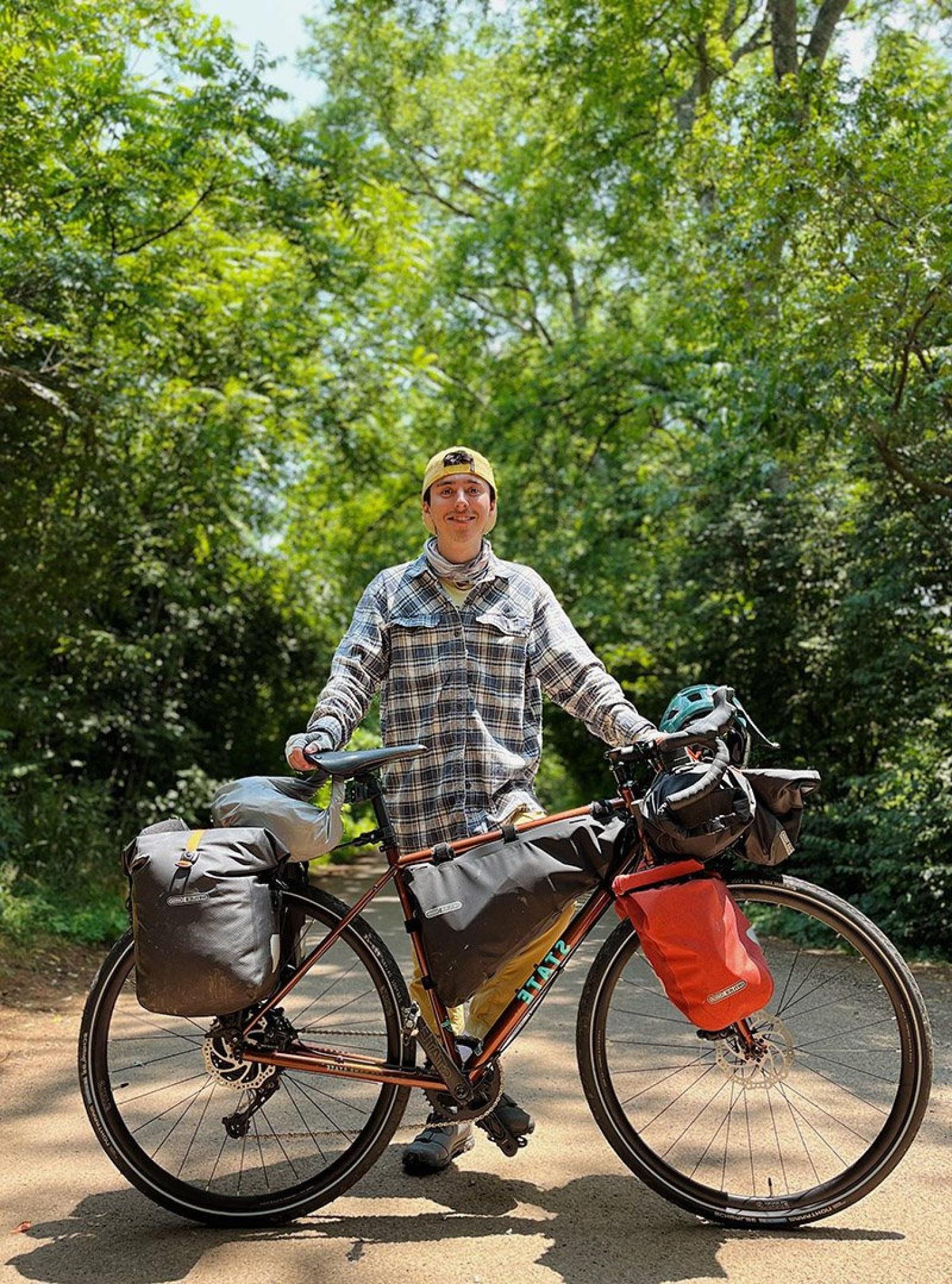 Lucas Beyer standing with his bike