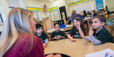 Lynch School student with St. Columbkille class