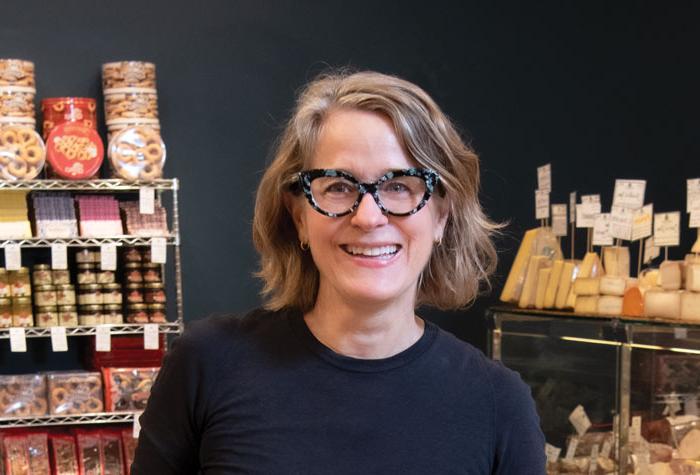 Valerie Gurdal ’85 in her shop Formaggio Kitchen