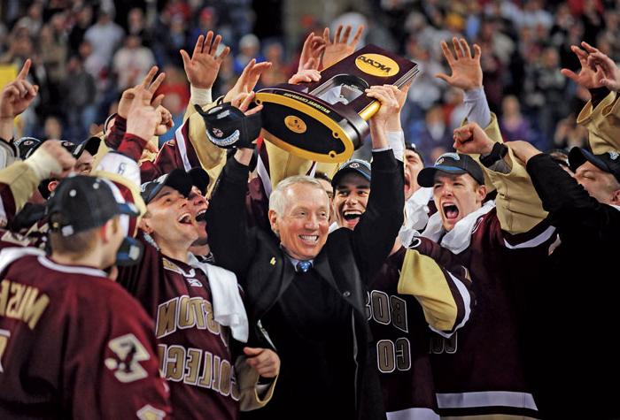 York and trophy surrounded by his team